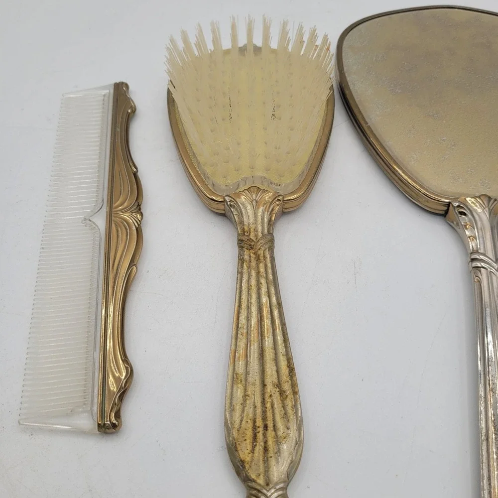 Vtg Vanity Set Hand Mirror, Hair Brush and Comb‎ Gold color trim and handle.
